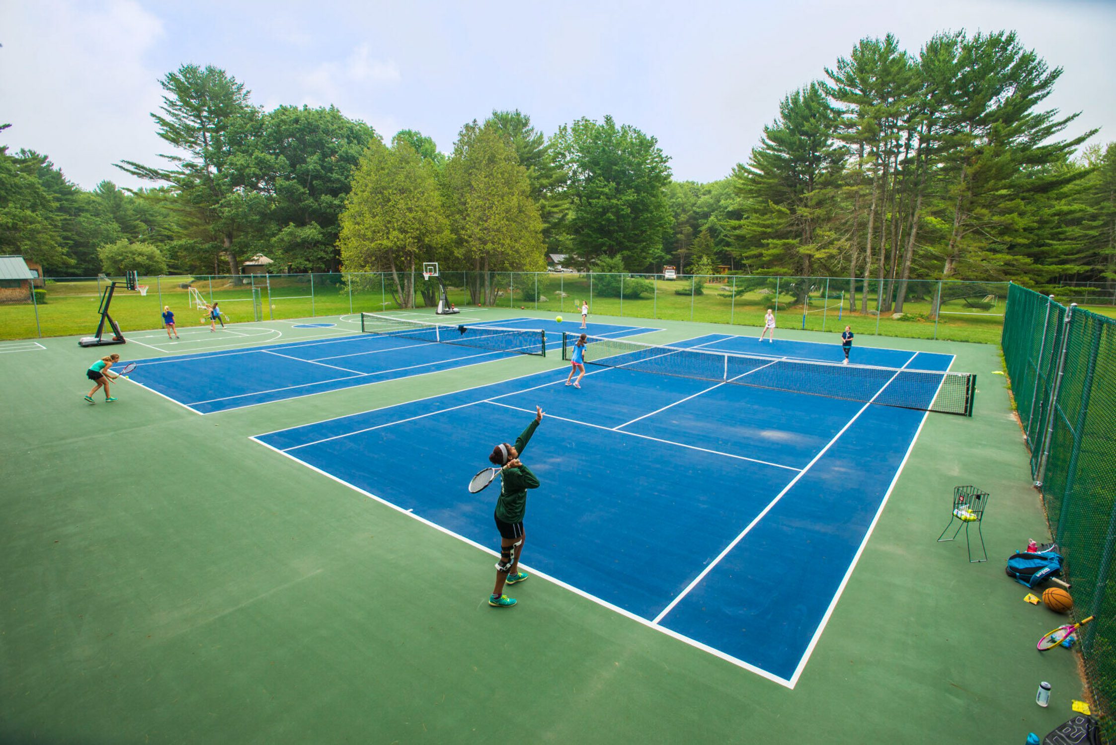 Aerial of campers on tennis courts